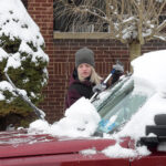 sweeping snow off